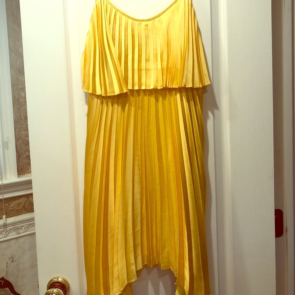 Pleated yellow spaghetti strap dress